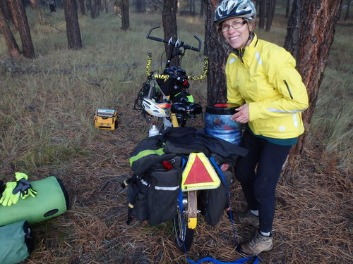 GDMBR: Terry is placing the Bear Safe (food) into the right rear pannier.
